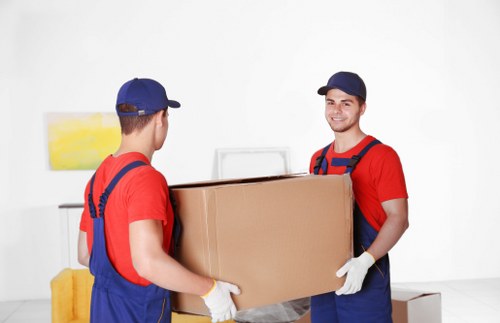 Flat removals team handling apartment move in Enfield