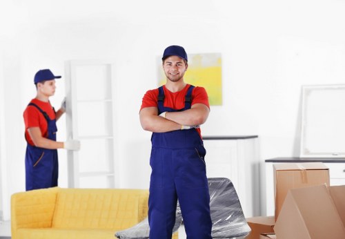 Careful loading of household furniture for transport in Enfield