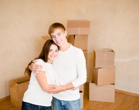 Removalists loading furniture and boxed household items for an Enfield home relocation