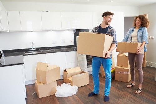 Careful loading of a piano into a specialist moving vehicle